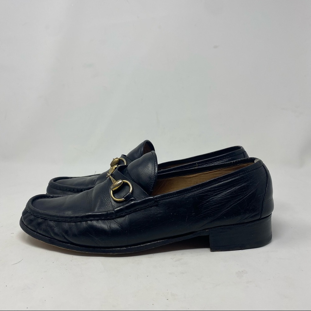 Gucci Dark Leather Loafers with Gold Accent